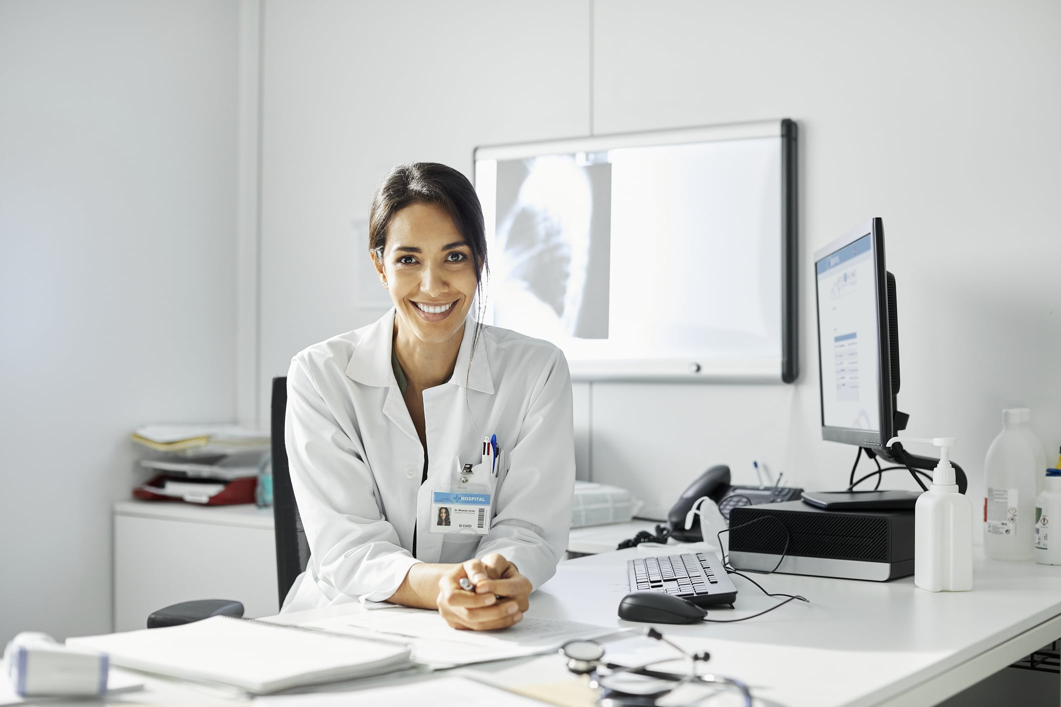 Confident female doctor working in clinic